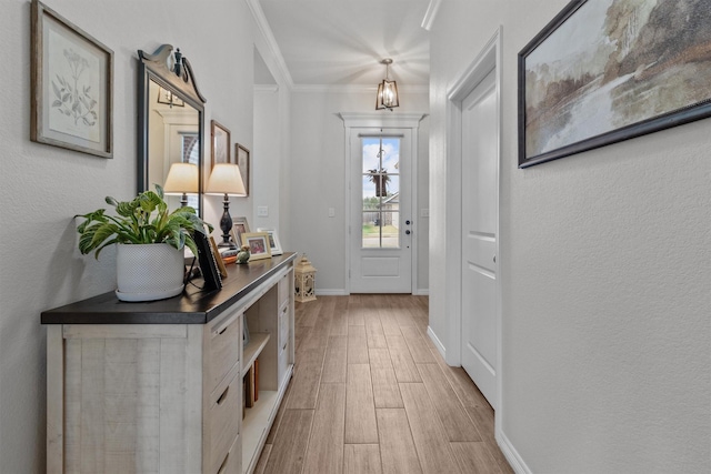 doorway to outside featuring ornamental molding