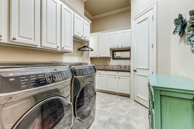 laundry room with cabinets, sink, ornamental molding, independent washer and dryer, and light tile patterned flooring