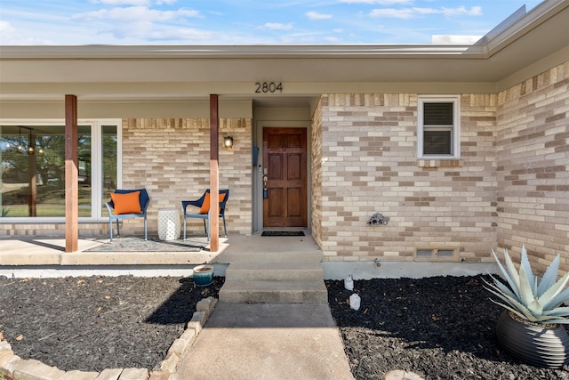 doorway to property with covered porch