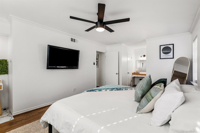 bedroom featuring dark hardwood / wood-style floors, ceiling fan, and ornamental molding