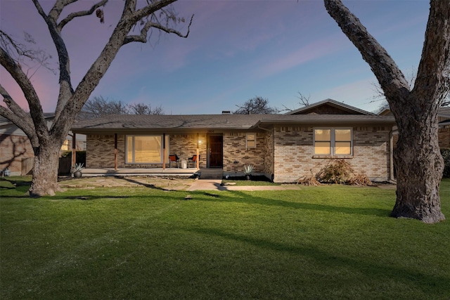 view of front of home with a yard