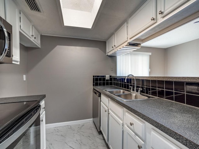 kitchen with sink, white cabinetry, dishwasher, and range with electric cooktop