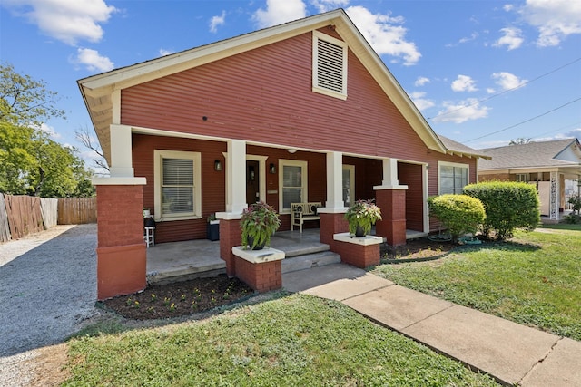 view of front facade with a porch and a front yard