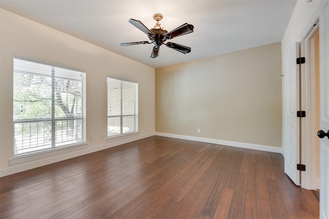 spare room featuring hardwood / wood-style flooring and ceiling fan