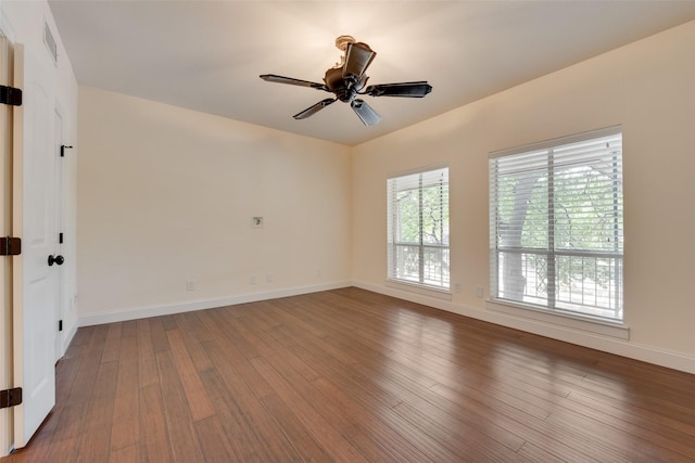 spare room with hardwood / wood-style flooring and ceiling fan