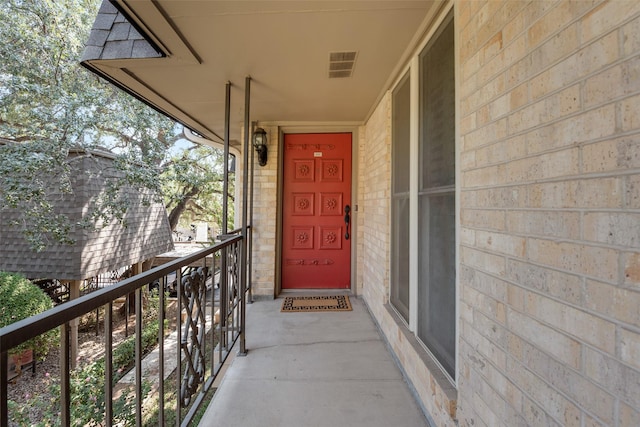 property entrance with a balcony