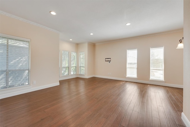 spare room featuring ornamental molding and wood-type flooring