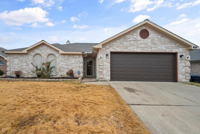 ranch-style house with a garage, brick siding, and driveway