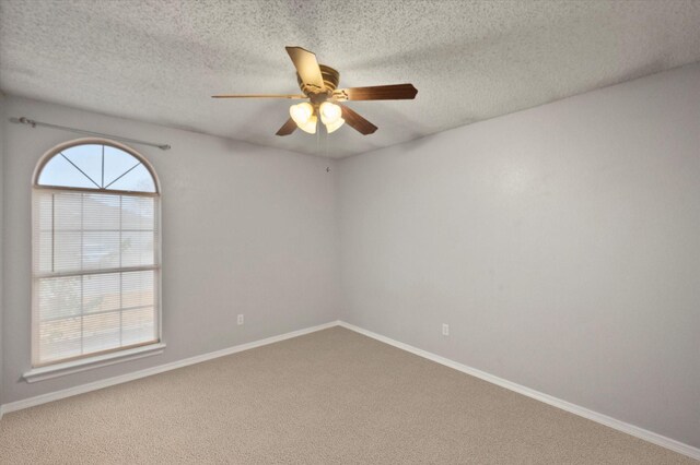 unfurnished room featuring ceiling fan, a textured ceiling, and light hardwood / wood-style floors