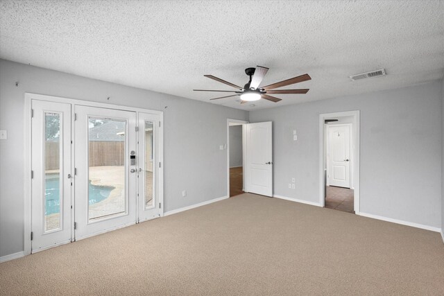 unfurnished room with wood-type flooring, ceiling fan, and a textured ceiling