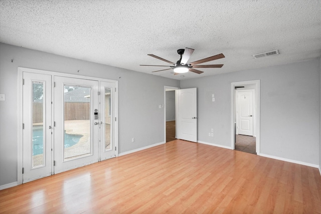 8104 Jolie Dr, Fort Worth, TX 76137 - unfurnished bedroom featuring access to outside, wood finished floors, a textured ceiling, and baseboards