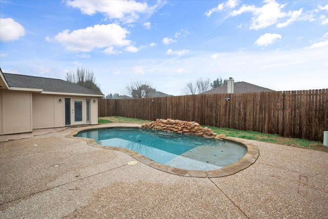 view of swimming pool featuring a patio area