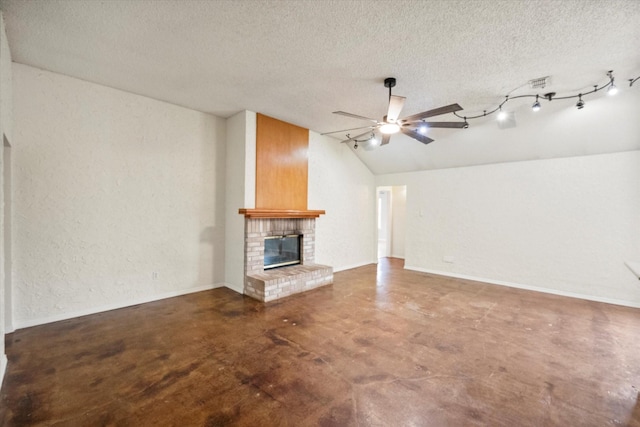 8104 Jolie Dr, Fort Worth, TX 76137 - unfurnished living room featuring vaulted ceiling, ceiling fan, concrete flooring, a fireplace, and a textured ceiling