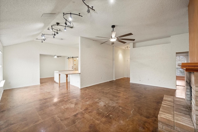 8104 Jolie Dr, Fort Worth, TX 76137 - unfurnished living room featuring a ceiling fan, a textured ceiling, vaulted ceiling, finished concrete floors, and track lighting