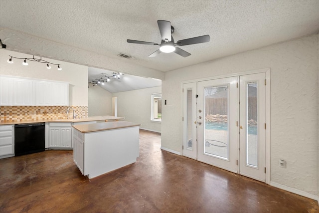 8104 Jolie Dr, Fort Worth, TX 76137 - kitchen featuring black dishwasher, decorative backsplash, concrete floors, a textured ceiling, and white cabinetry
