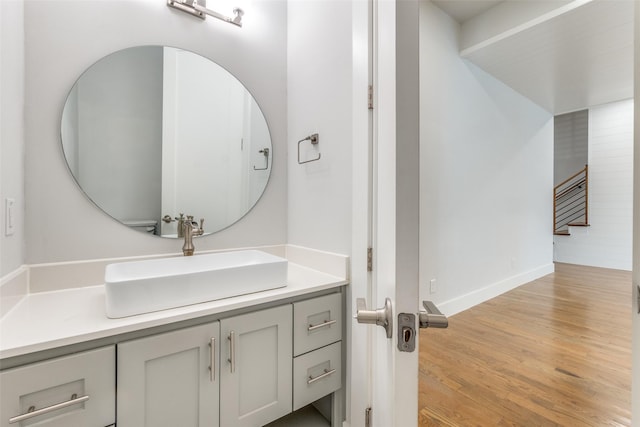 bathroom with vanity and hardwood / wood-style flooring