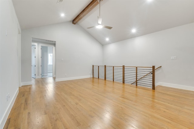 spare room featuring ceiling fan, light hardwood / wood-style floors, beam ceiling, and high vaulted ceiling