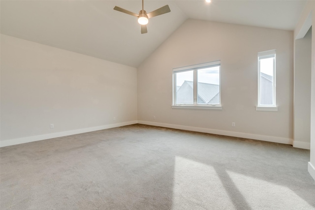 additional living space with light carpet, ceiling fan, and vaulted ceiling