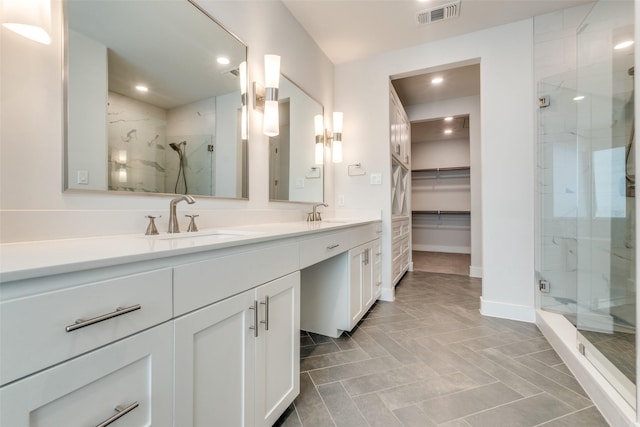 bathroom with vanity, tile patterned floors, and walk in shower