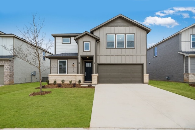 view of front of home with a garage, a front yard, and central air condition unit