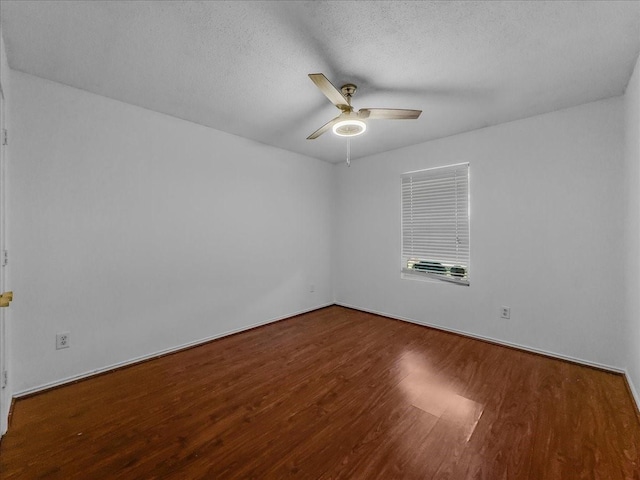 empty room with hardwood / wood-style flooring, a textured ceiling, and ceiling fan