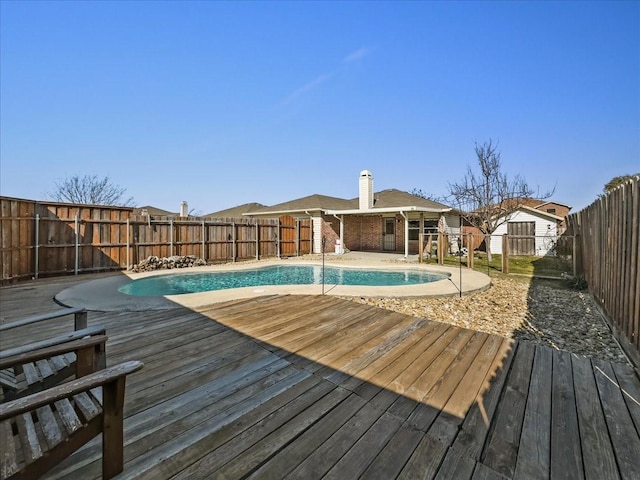 view of pool featuring a wooden deck