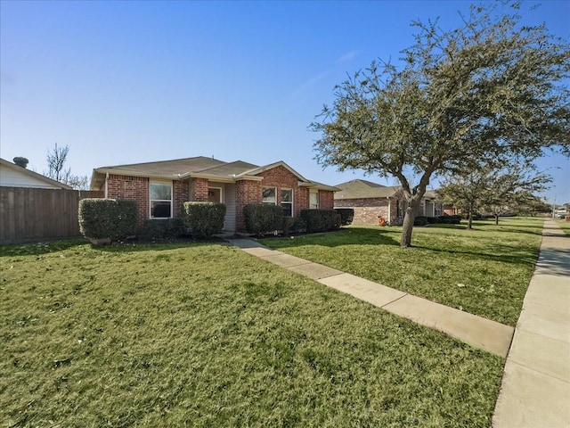 single story home featuring a front lawn