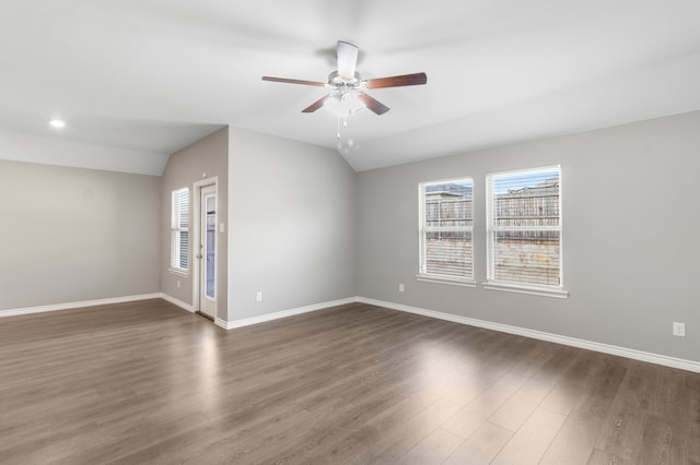418 Rawhide Way, Princeton, TX 75407 - spare room with vaulted ceiling, ceiling fan, dark wood-style floors, and baseboards