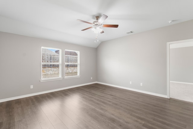 unfurnished room featuring lofted ceiling, ceiling fan, and dark hardwood / wood-style floors