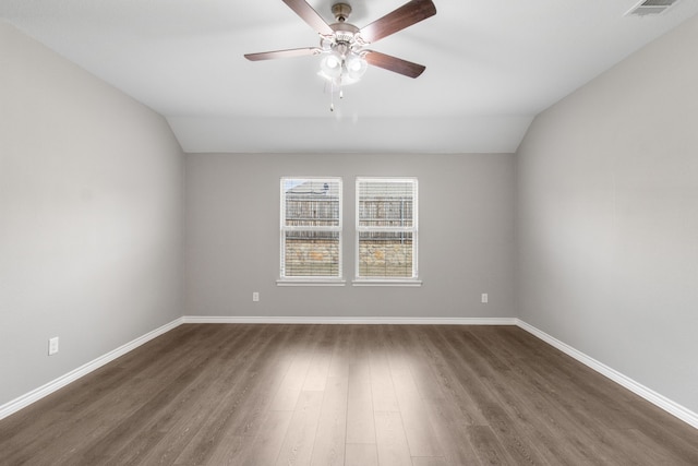 418 Rawhide Way, Princeton, TX 75407 - spare room featuring lofted ceiling, dark wood finished floors, ceiling fan, and baseboards