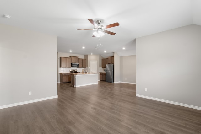 418 Rawhide Way, Princeton, TX 75407 - unfurnished living room featuring a ceiling fan, baseboards, dark wood finished floors, and recessed lighting