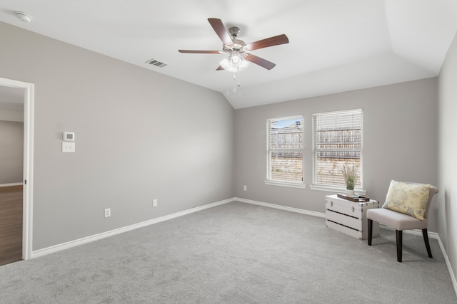 unfurnished room with ceiling fan, vaulted ceiling, and carpet flooring