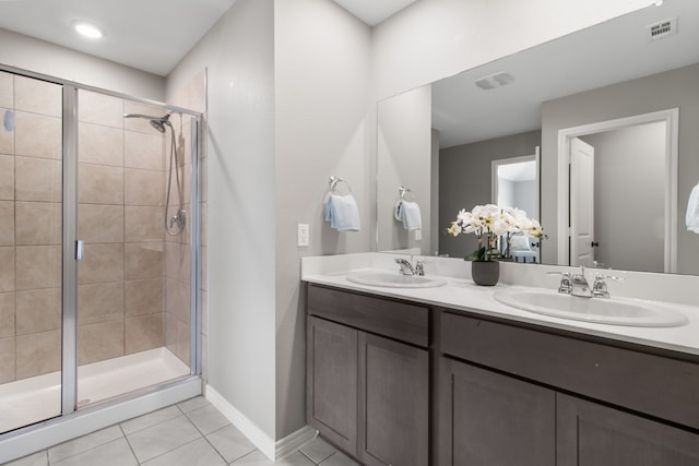 418 Rawhide Way, Princeton, TX 75407 - full bath featuring tile patterned flooring, a stall shower, double vanity, and baseboards