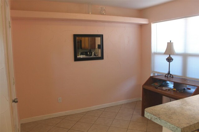 carpeted bedroom featuring ceiling fan, a tray ceiling, and multiple windows