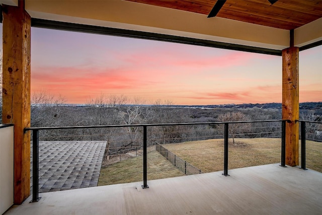 view of balcony at dusk