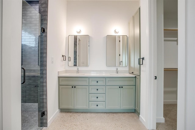 bathroom with walk in shower and vanity