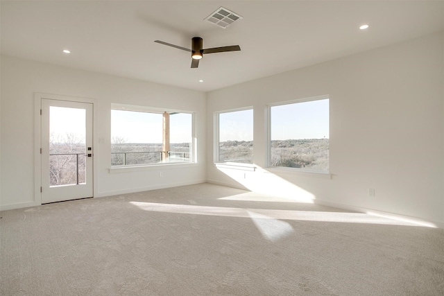 carpeted empty room with ceiling fan