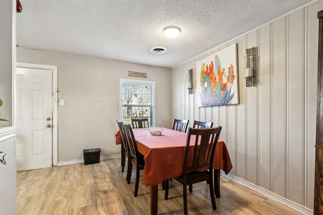 dining space featuring light hardwood / wood-style floors