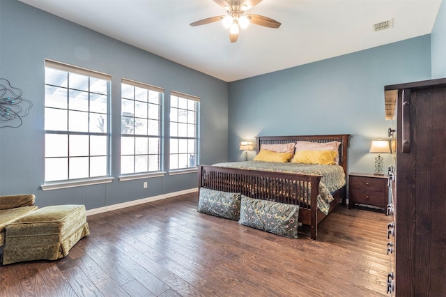 bedroom featuring ceiling fan and dark wood-type flooring