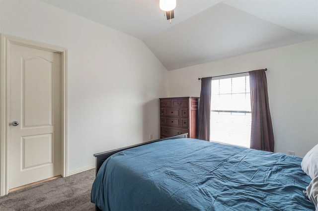 carpeted bedroom with ceiling fan and lofted ceiling