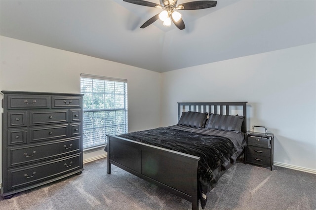 bedroom with ceiling fan, vaulted ceiling, and dark carpet