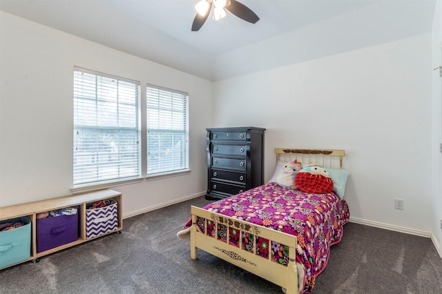 carpeted bedroom with vaulted ceiling and ceiling fan