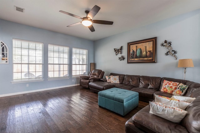 living room with dark wood-type flooring and ceiling fan