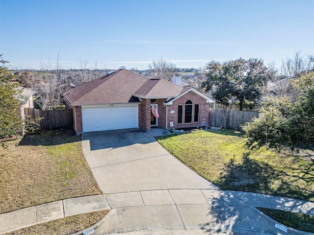 ranch-style home featuring a front yard, fence, and brick siding