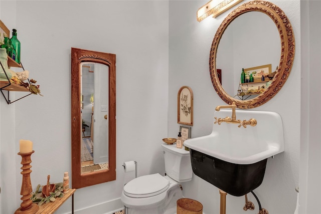 bathroom with toilet and sink