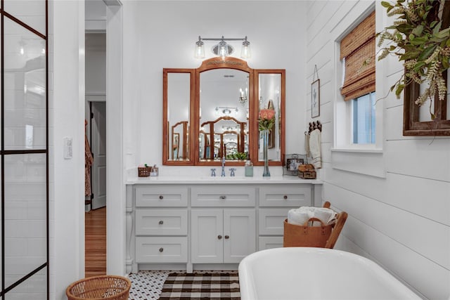 bathroom featuring vanity and a tub