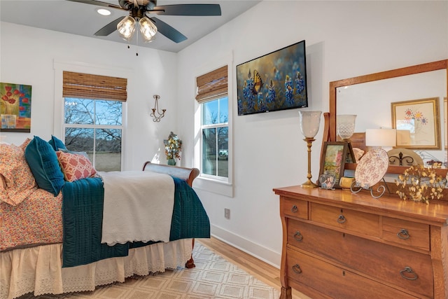 bedroom featuring ceiling fan and light hardwood / wood-style flooring