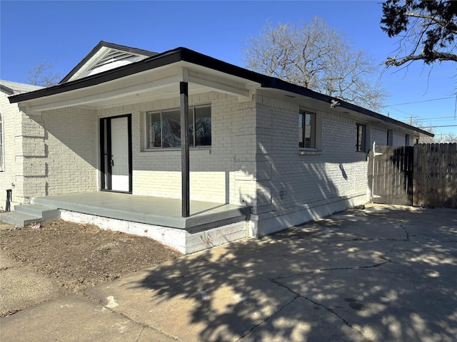 view of side of property with a porch