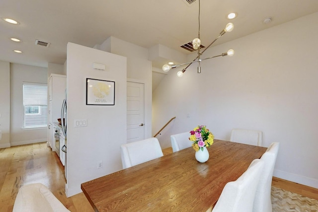 dining area with light wood-type flooring