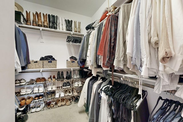 walk in closet featuring carpet floors